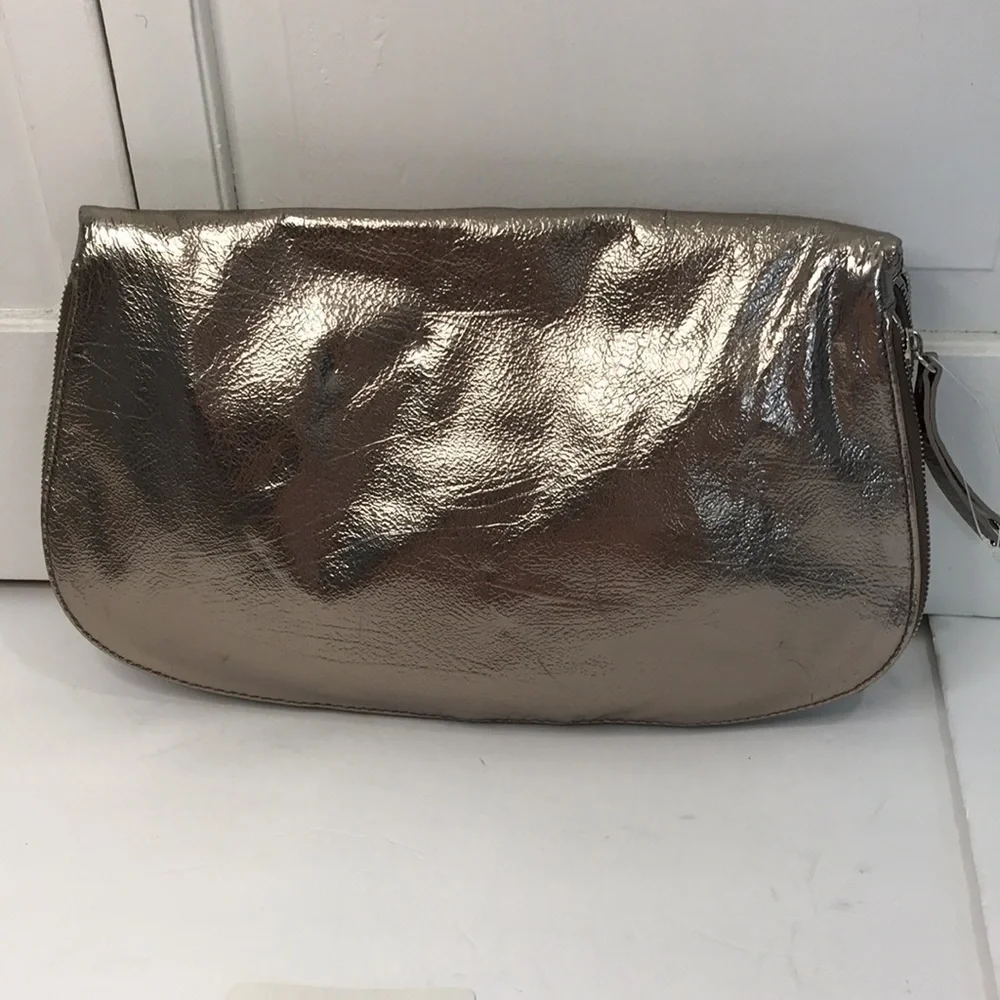 Price is firm NINE WEST Metallic Silver Zip Magnet Fold Clutch